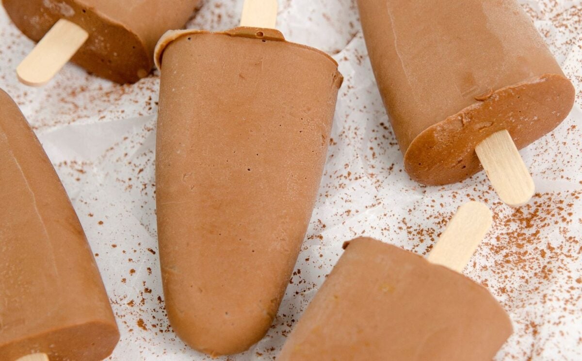 homemade vegan fudgesicles made with cocoa powder, nut butter, plant-based milk, and coconut sugar